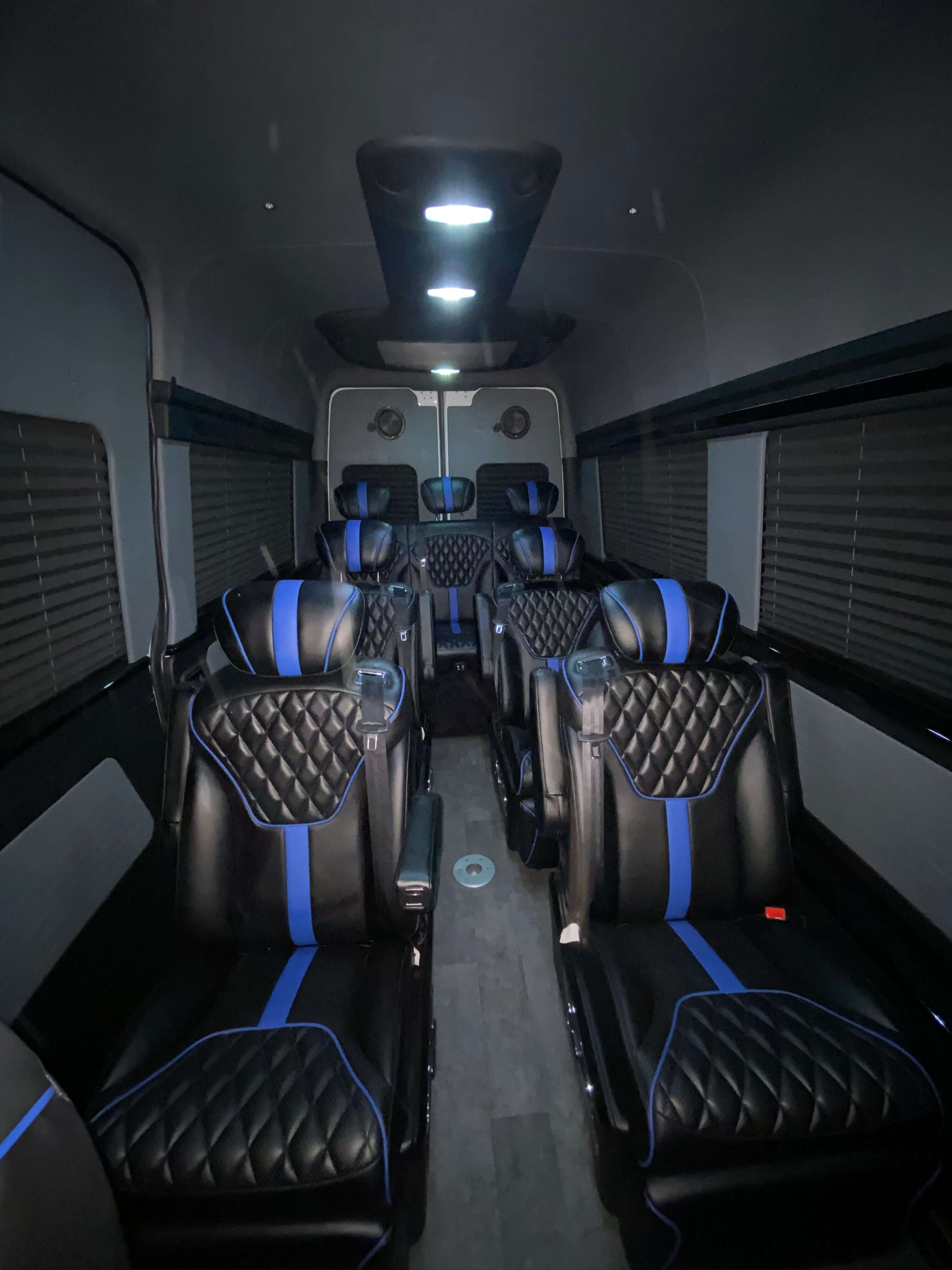 Black leather van conversion interior with blue racing-stripe accent seating
