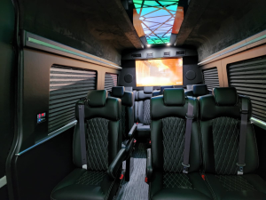 Blue LED-lit van conversion captain chairs with starlight ceiling