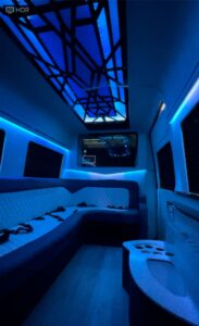 Tablet entertainment control in a cream leather van conversion interior