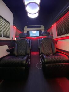 Red leather van conversion interior showcasing custom upholstery craftsmanship